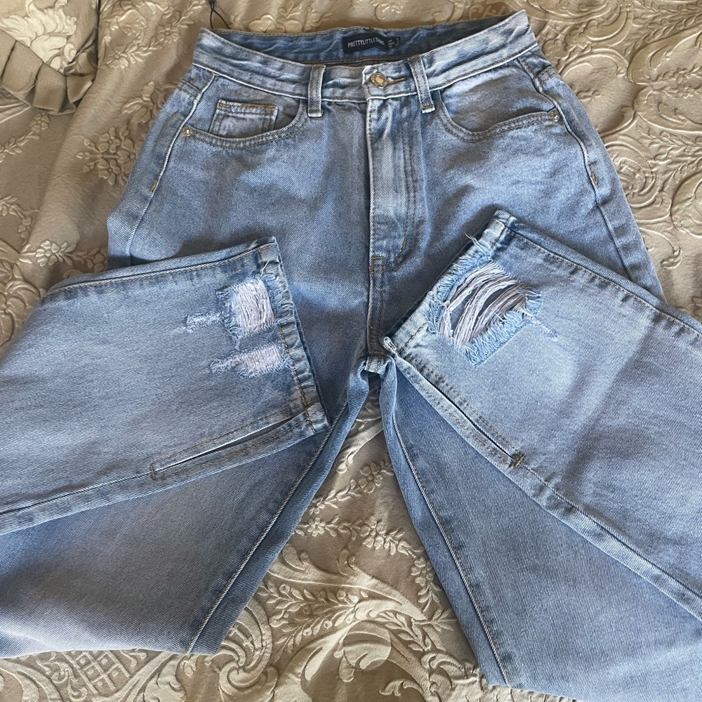 brand new pretty little thing jeans with rips open cut at the bottom